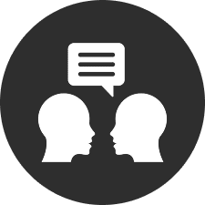 Two silhouettes with speech bubble icon.